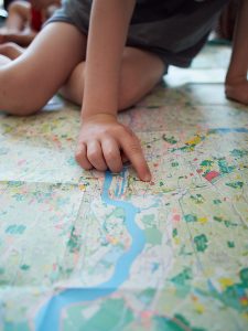 Boy-pointing-at-London-National-Park-City-Map-225x300